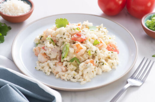 White plate with cilantro and shrimp creamy risotto