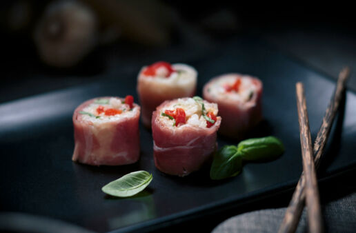 Four slices of Italian sushi with arborio and prosciutto