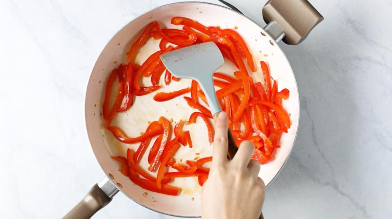 Sauteeing red pepper in a skillet
